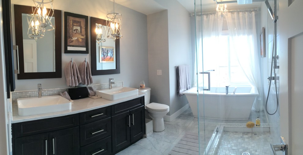 Inspiration for a small eclectic master gray tile and stone tile marble floor bathroom remodel in Calgary with a vessel sink, shaker cabinets, dark wood cabinets, marble countertops, a two-piece toilet and gray walls