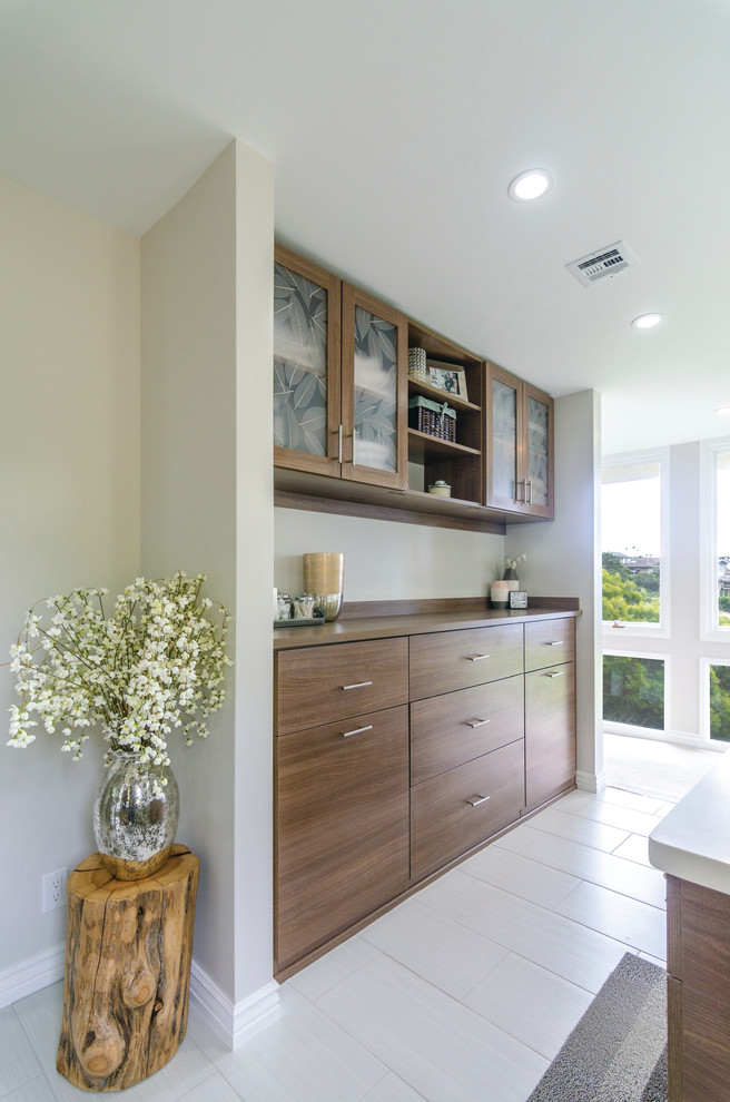 Inspiration for a large transitional master ceramic tile bathroom remodel in Hawaii with flat-panel cabinets, white walls, dark wood cabinets and solid surface countertops