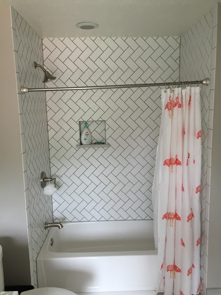 Design ideas for a medium sized traditional shower room bathroom in Cleveland with shaker cabinets, grey cabinets, an alcove bath, a shower/bath combination, a two-piece toilet, white tiles, metro tiles, grey walls, porcelain flooring, a submerged sink, marble worktops and a shower curtain.