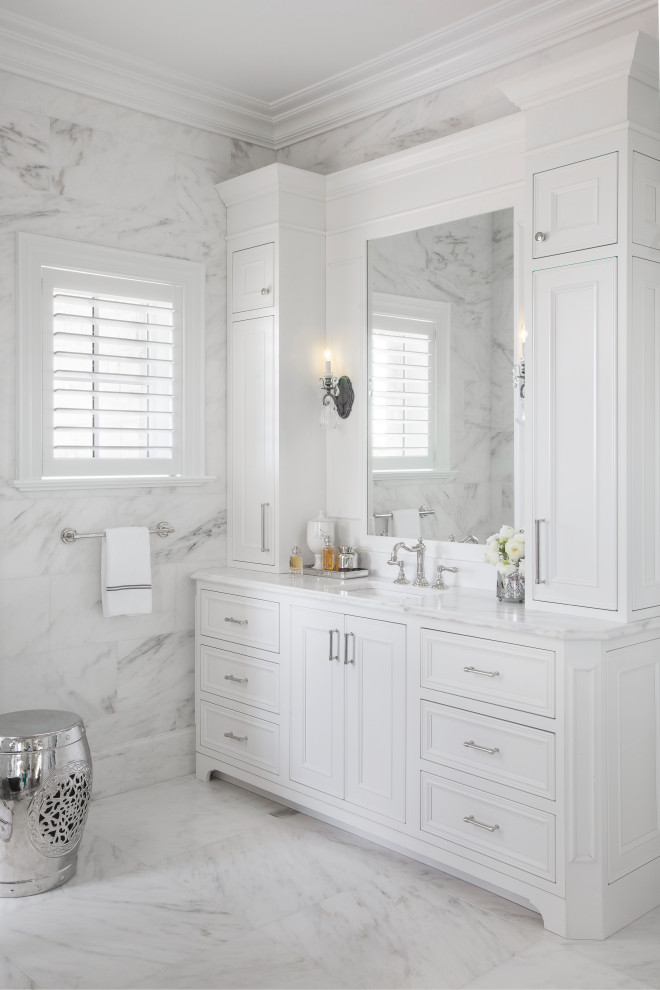 Example of a french country white tile and stone slab white floor bathroom design in St Louis with recessed-panel cabinets, white cabinets, white walls, an undermount sink, white countertops and a freestanding vanity