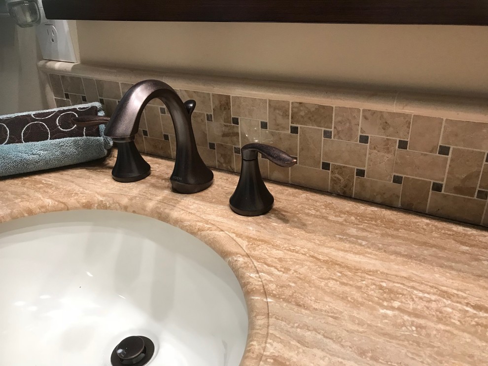 Example of a mid-sized tuscan master ceramic tile and beige tile ceramic tile and beige floor bathroom design in Baltimore with raised-panel cabinets, a two-piece toilet, gray walls, granite countertops, dark wood cabinets and an undermount sink