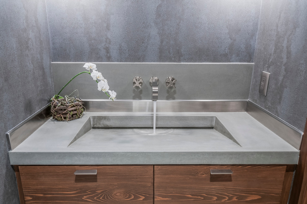 This is an example of a medium sized modern bathroom in Miami with flat-panel cabinets, medium wood cabinets, grey walls, an integrated sink and concrete worktops.