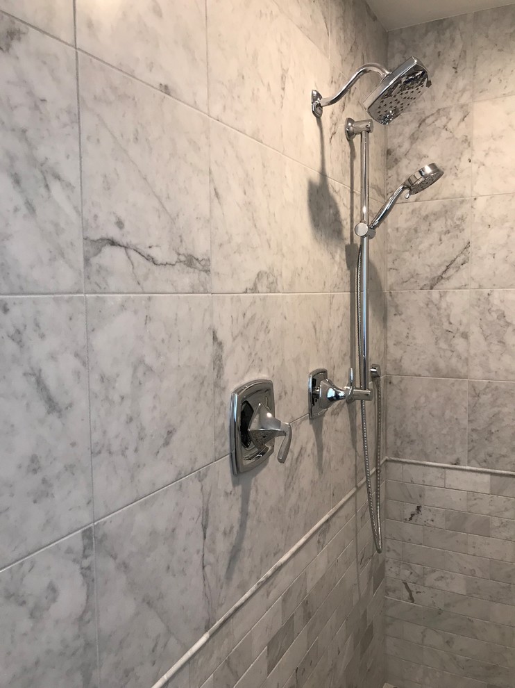 Inspiration for a large contemporary ensuite wet room bathroom in Richmond with raised-panel cabinets, grey cabinets, a submerged bath, a two-piece toilet, black and white tiles, stone tiles, blue walls, laminate floors, a submerged sink, quartz worktops, beige floors, an open shower and white worktops.