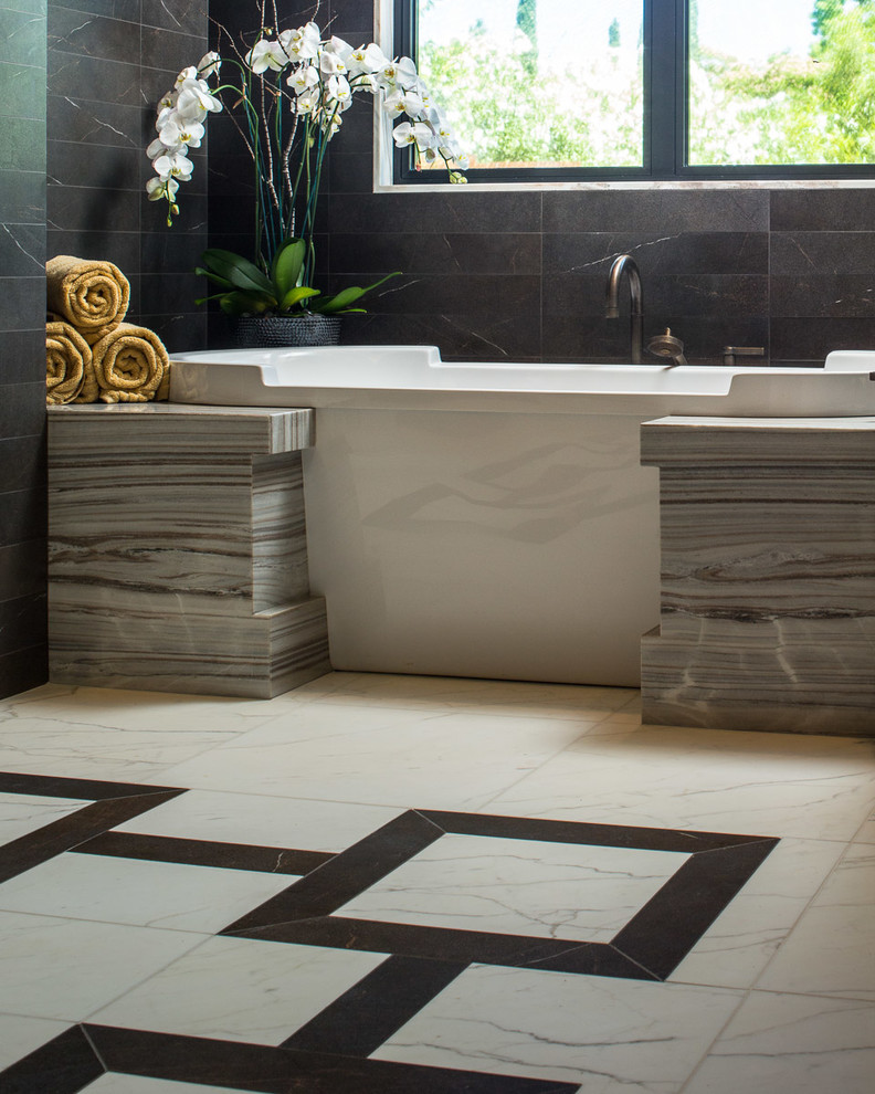 Inspiration for an expansive contemporary ensuite bathroom in San Francisco with flat-panel cabinets, brown cabinets, a freestanding bath, a built-in shower, a one-piece toilet, beige tiles, stone tiles, beige walls, marble flooring, a built-in sink and marble worktops.