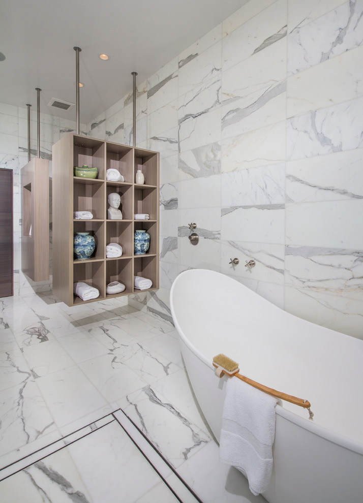 This is an example of a medium sized contemporary ensuite bathroom in San Diego with a vessel sink, flat-panel cabinets, light wood cabinets, engineered stone worktops, a freestanding bath, a built-in shower, white tiles, stone tiles, white walls and marble flooring.