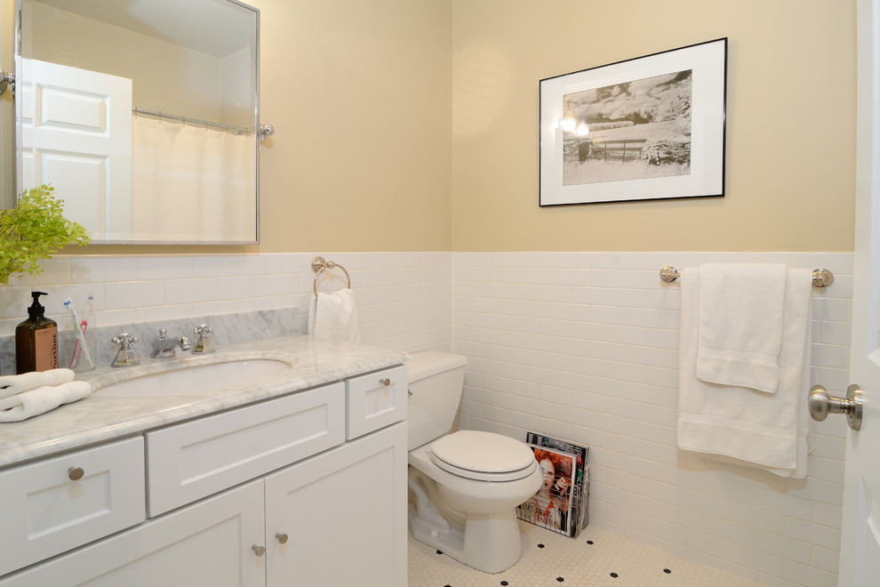 Photo of a traditional bathroom in New York with a submerged sink, shaker cabinets, white cabinets, granite worktops, a hot tub, white tiles and ceramic tiles.