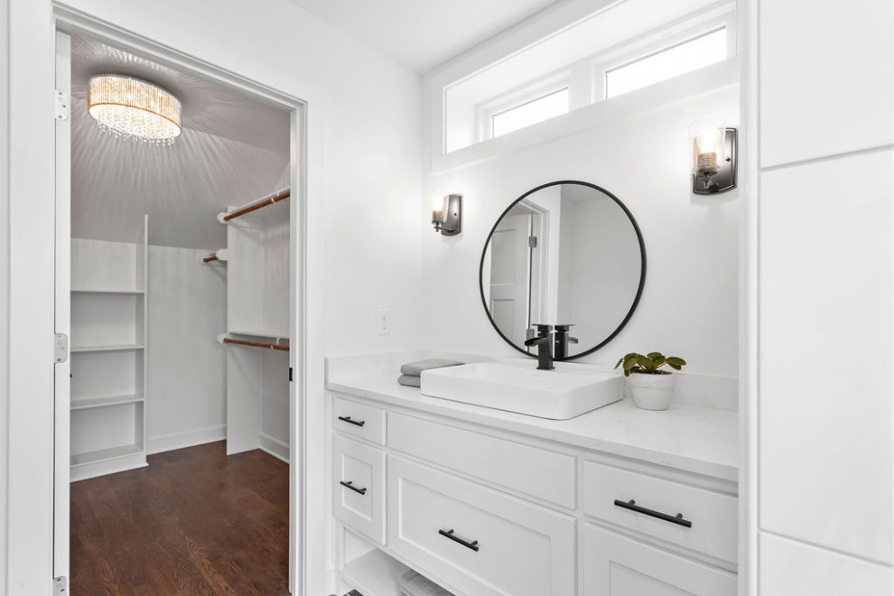 This is an example of a medium sized country shower room bathroom in Kansas City with recessed-panel cabinets, white cabinets, an alcove shower, a two-piece toilet, white walls, ceramic flooring, a vessel sink, engineered stone worktops, grey floors, a hinged door, white worktops, an enclosed toilet, a single sink and a built in vanity unit.