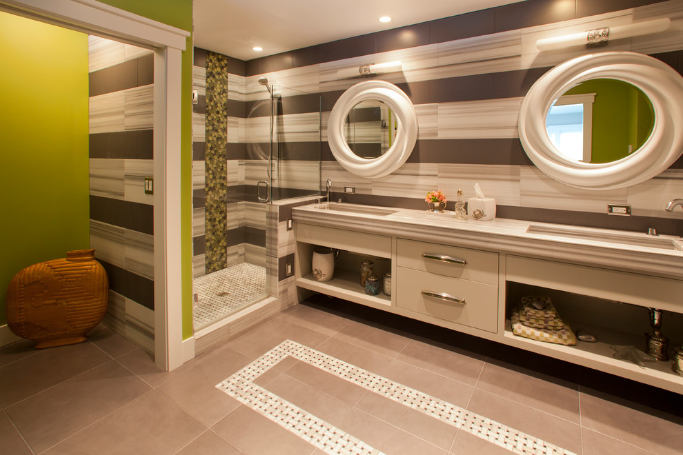 This is an example of a beach style bathroom in Seattle with a submerged sink, flat-panel cabinets, beige cabinets, an alcove shower and multi-coloured tiles.