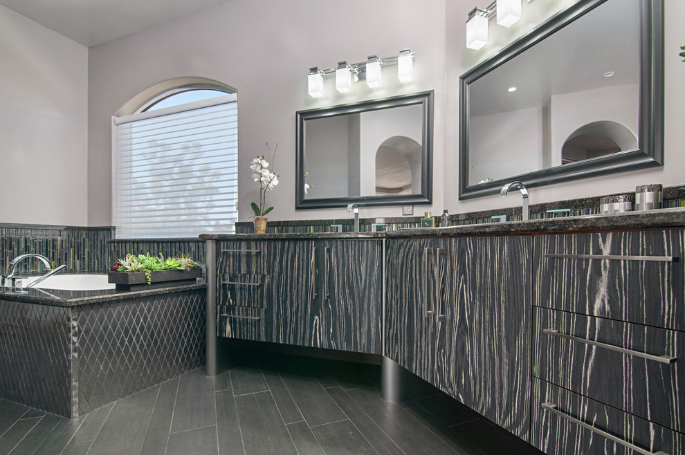 Mid-sized transitional master gray tile and glass tile porcelain tile drop-in bathtub photo in San Diego with flat-panel cabinets, gray cabinets, multicolored walls and marble countertops