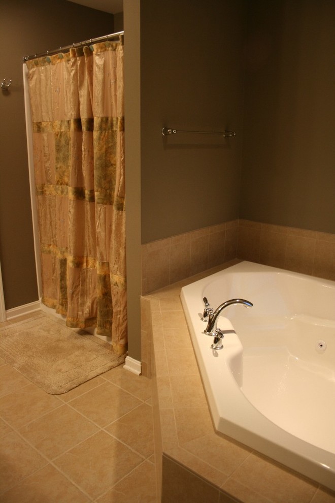 Photo of a medium sized traditional ensuite bathroom in Philadelphia with a corner bath, a walk-in shower, beige floors and a shower curtain.