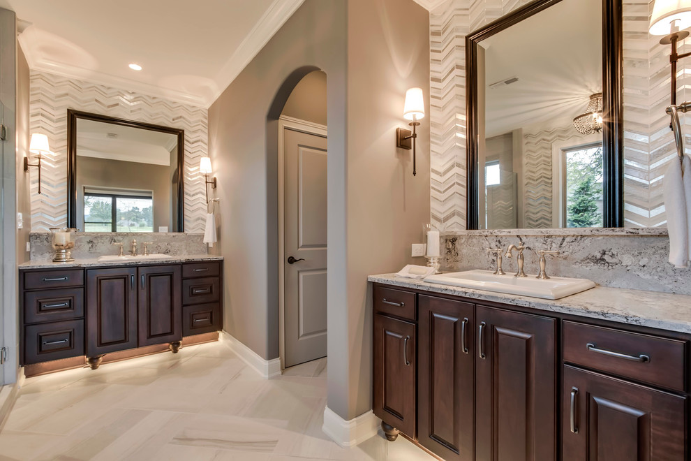 Design ideas for a medium sized beach style ensuite bathroom in Nashville with a built-in sink, beaded cabinets, medium wood cabinets, marble worktops, a freestanding bath, a corner shower, white tiles, stone tiles and grey walls.