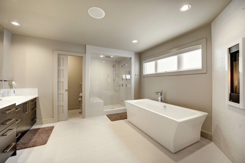 Example of a large minimalist master beige tile and ceramic tile ceramic tile bathroom design in Edmonton with an integrated sink, flat-panel cabinets, dark wood cabinets, quartzite countertops, a one-piece toilet and gray walls