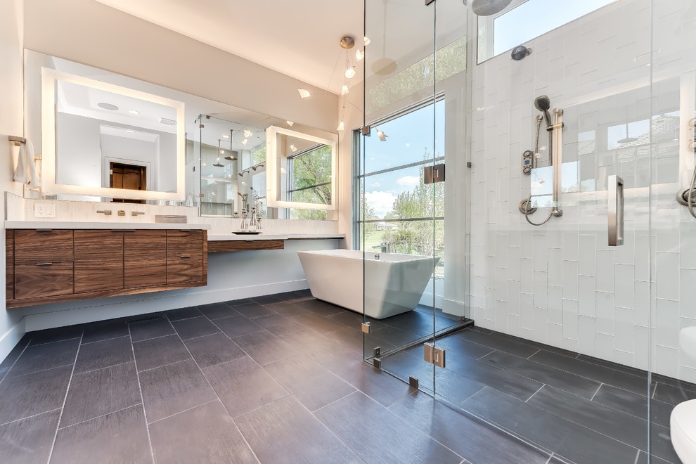 Trendy master white tile gray floor bathroom photo in Other with flat-panel cabinets, dark wood cabinets, white walls and a hinged shower door