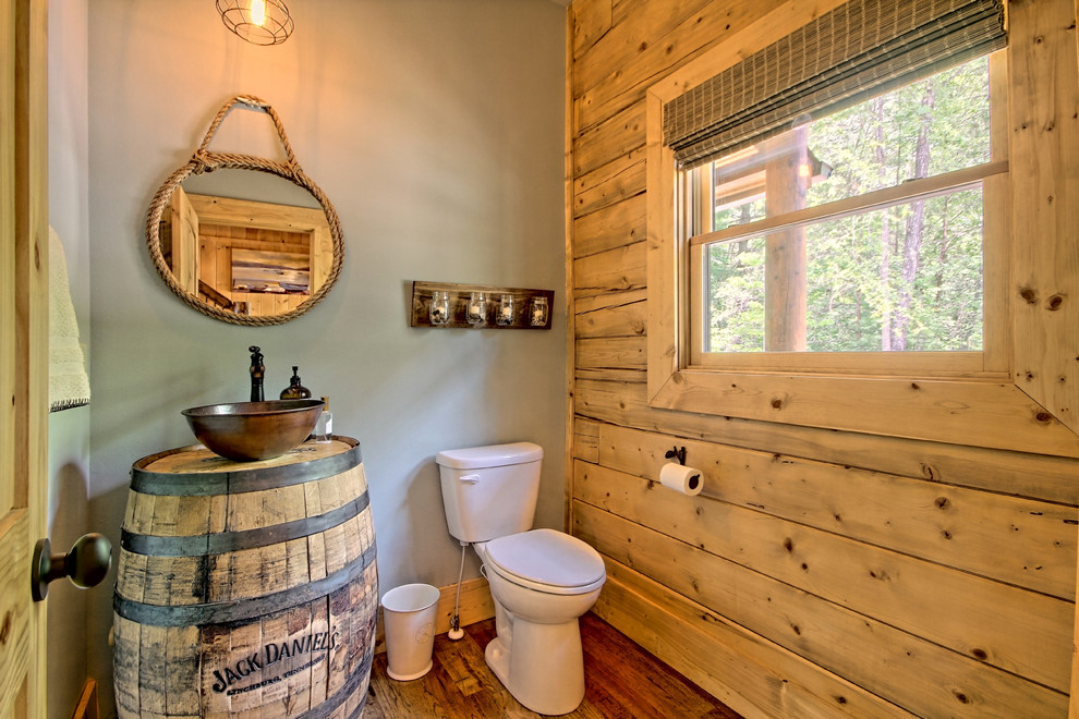 Design ideas for a small rustic bathroom in Atlanta with a two-piece toilet, a vessel sink, wooden worktops and medium hardwood flooring.