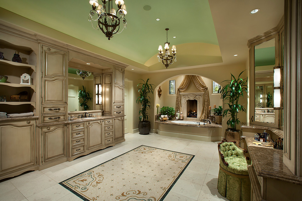 Design ideas for a large mediterranean ensuite bathroom in Phoenix with white cabinets, white tiles and beige walls.