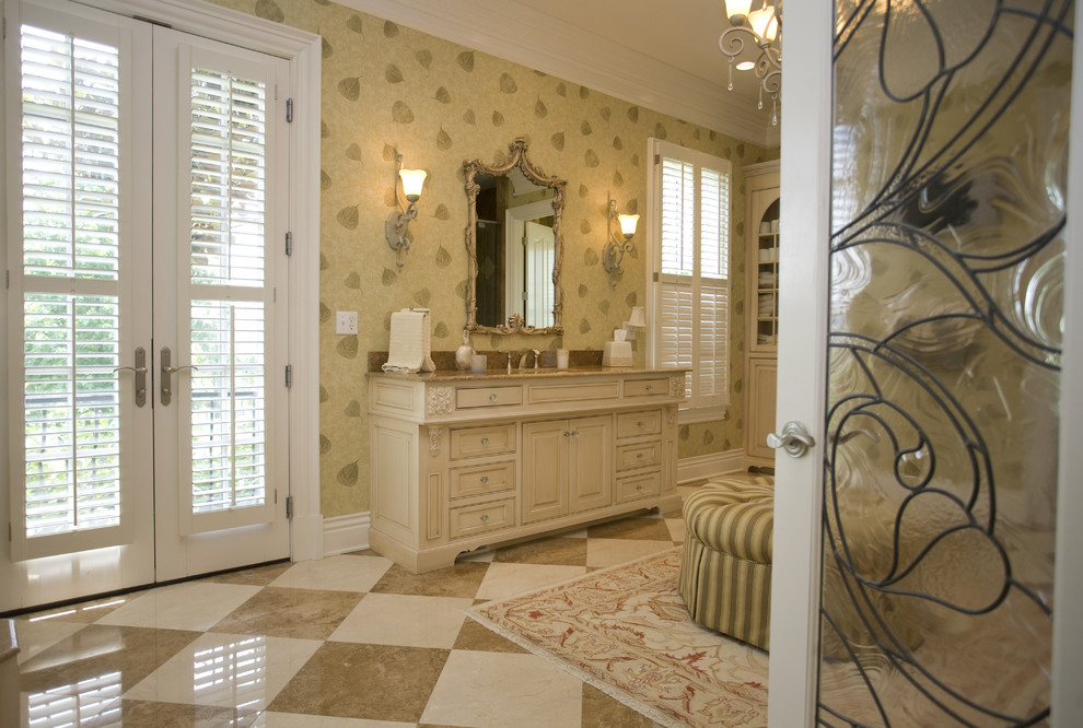Mid-sized elegant 3/4 marble floor and multicolored floor bathroom photo in Louisville with raised-panel cabinets, beige cabinets, multicolored walls and granite countertops
