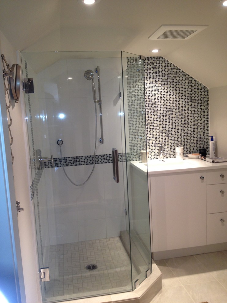 Inspiration for a large contemporary master multicolored tile and glass tile corner shower remodel in Vancouver with white walls, flat-panel cabinets, white cabinets and quartzite countertops