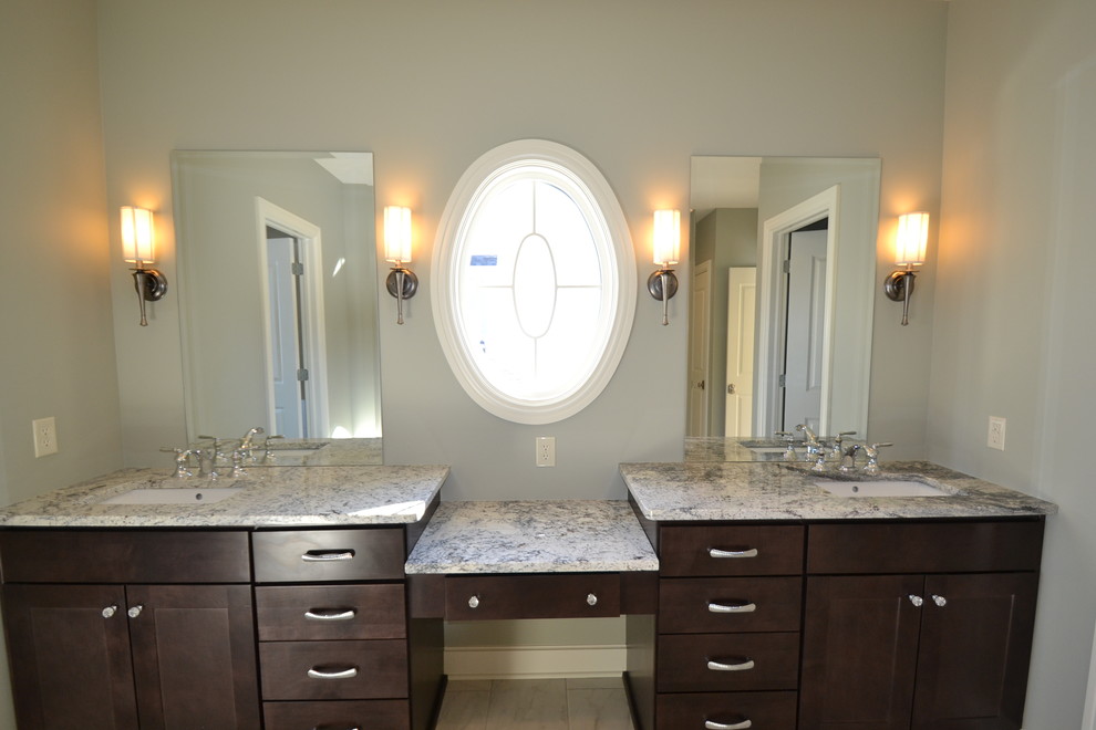 На фото: ванная комната в стиле неоклассика (современная классика) с врезной раковиной, фасадами в стиле шейкер, темными деревянными фасадами, столешницей из гранита, двойным душем, белой плиткой и керамогранитной плиткой