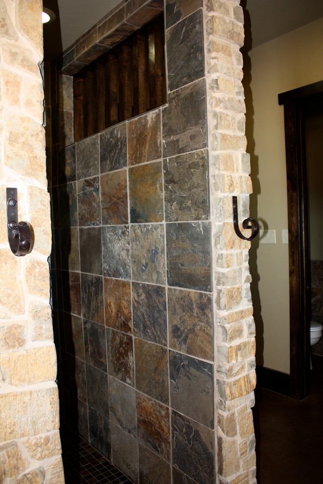 Large mountain style master beige tile and stone tile concrete floor bathroom photo in Houston with a drop-in sink, flat-panel cabinets, dark wood cabinets, granite countertops and a one-piece toilet
