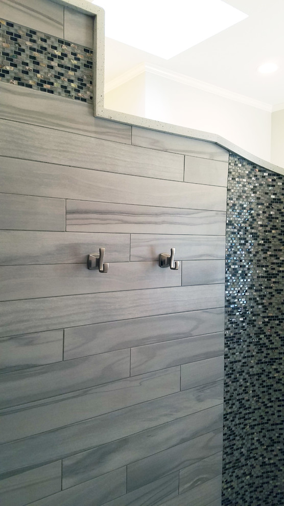 Large transitional master mosaic tile and multicolored tile porcelain tile and gray floor bathroom photo in Austin with shaker cabinets, white cabinets, white walls, a vessel sink, quartz countertops and white countertops