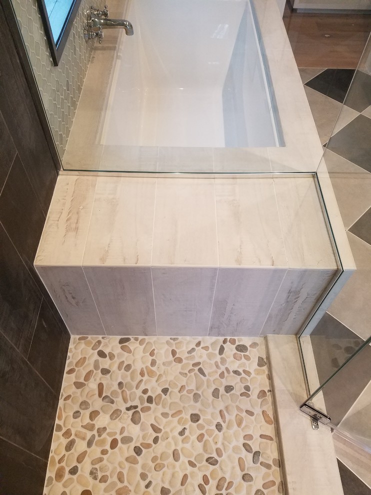 Inspiration for a medium sized contemporary ensuite bathroom in Orange County with a submerged bath, a corner shower, grey tiles, slate tiles, beige walls, ceramic flooring, multi-coloured floors and a hinged door.
