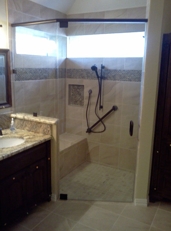 Inspiration for a beige tile and ceramic tile corner shower remodel in Dallas with granite countertops and beige walls