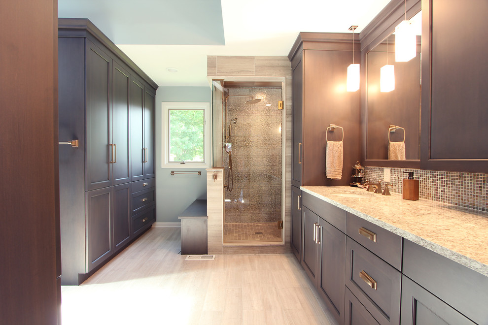 Inspiration for a large classic ensuite bathroom in Other with recessed-panel cabinets, grey cabinets, an alcove shower, a two-piece toilet, multi-coloured tiles, glass sheet walls, grey walls, limestone flooring, a submerged sink, engineered stone worktops, grey floors, a hinged door and beige worktops.