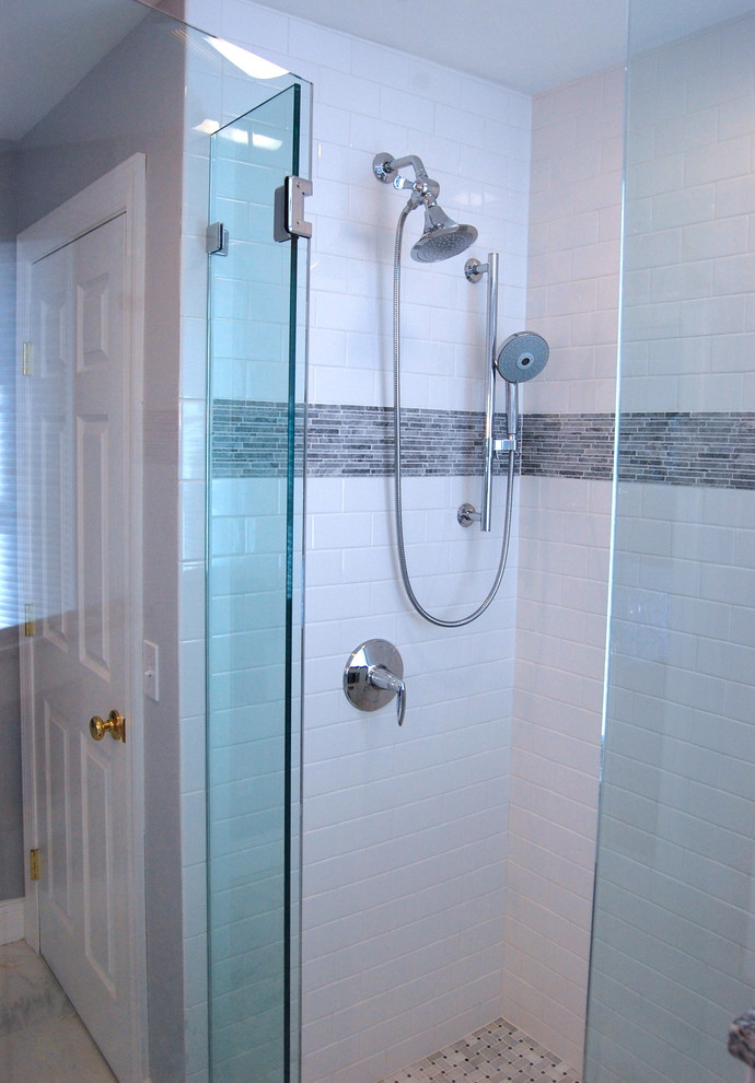 This is an example of a medium sized classic ensuite bathroom in Huntington with beaded cabinets, white cabinets, an alcove bath, a corner shower, a one-piece toilet, white tiles, metro tiles, grey walls, marble flooring, a submerged sink, marble worktops, white floors and a hinged door.