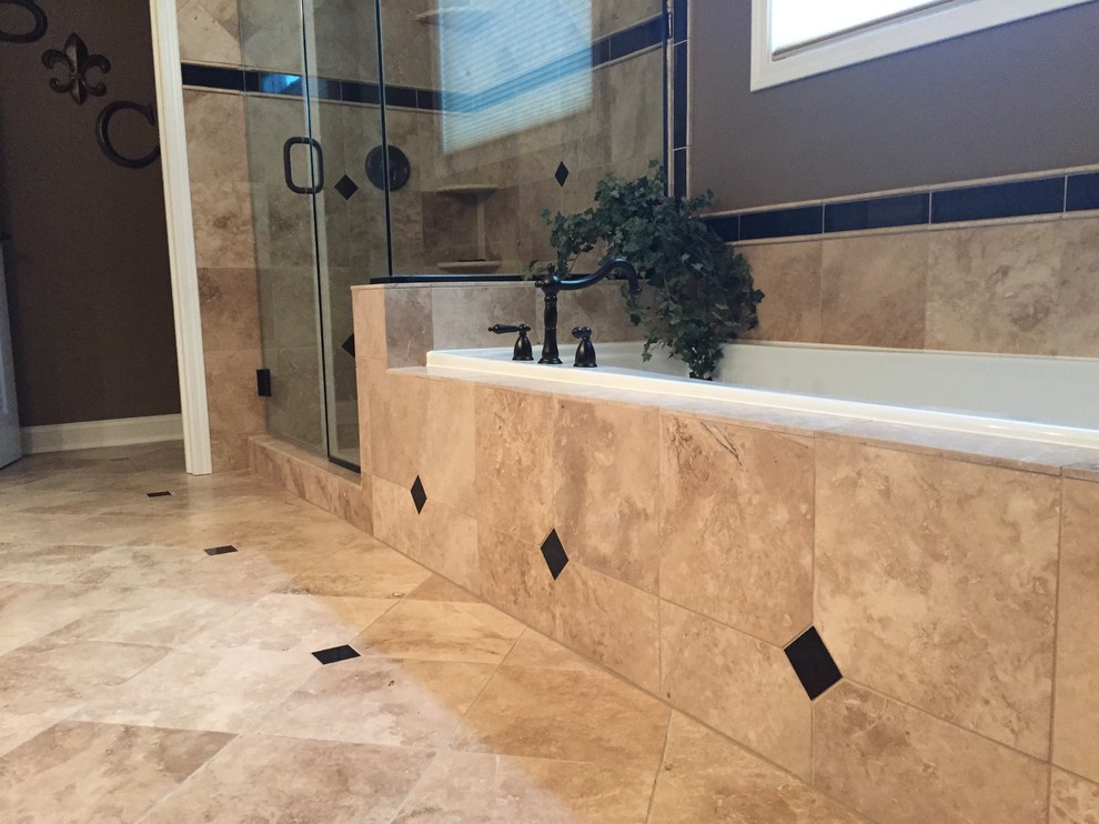 This is an example of a large contemporary ensuite bathroom in Cleveland with freestanding cabinets, dark wood cabinets, an alcove bath, an alcove shower, beige tiles, porcelain tiles, beige walls, travertine flooring, a submerged sink and granite worktops.