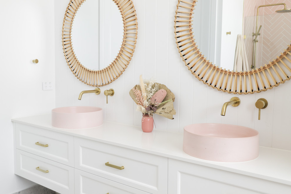 Example of a small beach style master single-sink and shiplap wall bathroom design in Gold Coast - Tweed with white walls, a vessel sink, granite countertops, white countertops, a floating vanity, recessed-panel cabinets and white cabinets
