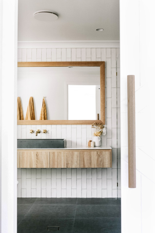 Rustic Industrial Vibe with Floating Vanity and Stone Vessel Sink