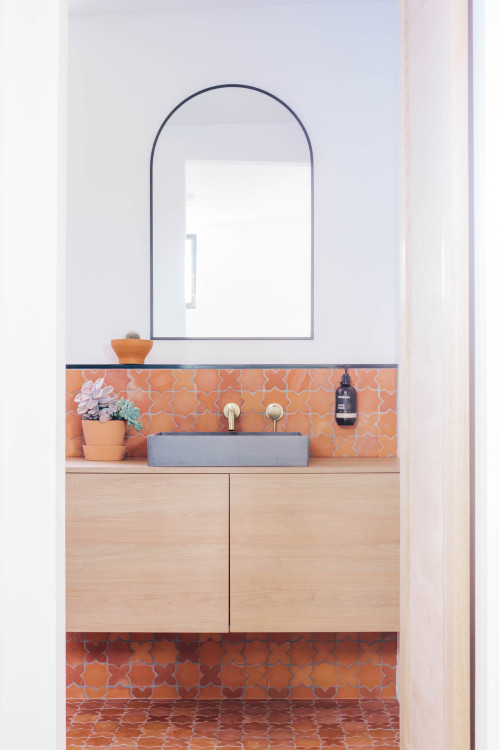 Earthy Harmony: Orange Clay Tiles, Wood Vanity, and Arched Mirror Ideas Transform Your Bathroom