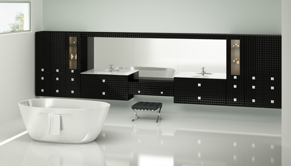 Modelo de cuarto de baño principal actual con lavabo tipo consola, armarios con paneles lisos, puertas de armario negras y encimera de vidrio