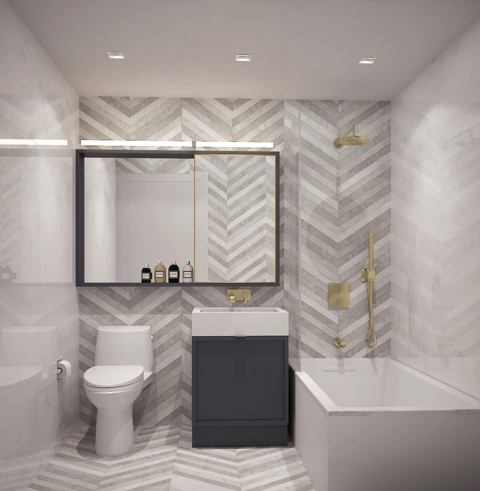 Design ideas for a medium sized contemporary ensuite bathroom in New York with recessed-panel cabinets, grey cabinets, a submerged bath, a shower/bath combination, a one-piece toilet, multi-coloured tiles, stone tiles, multi-coloured walls, limestone flooring, an integrated sink and quartz worktops.