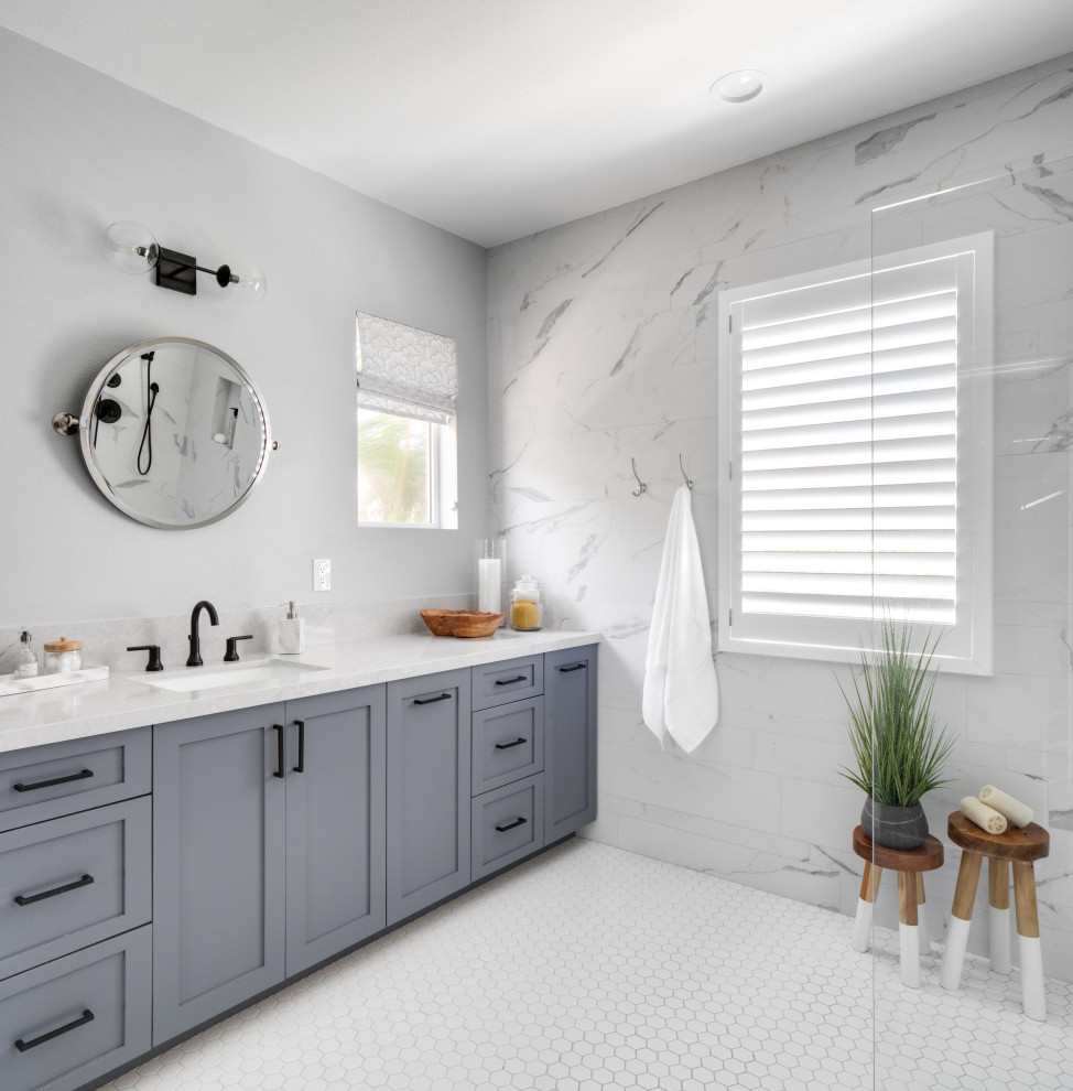 Inspiration for a mid-sized coastal master bathroom remodel in Orange County with light wood cabinets and shaker cabinets