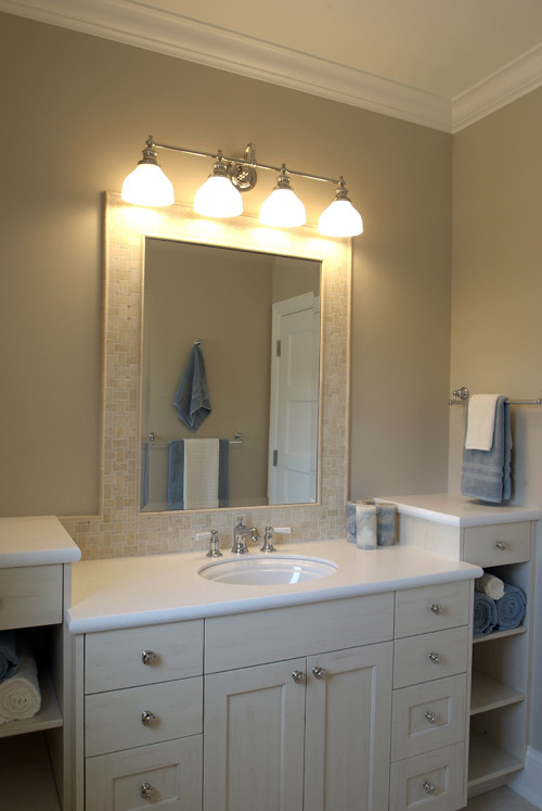 This is an example of a large classic ensuite bathroom in Grand Rapids with recessed-panel cabinets, white cabinets, beige walls, marble flooring, a submerged sink and marble worktops.