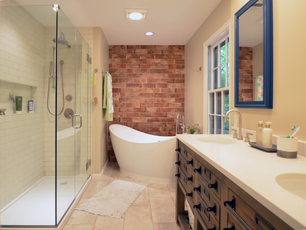 Bathroom - mid-sized industrial master beige tile and ceramic tile porcelain tile and gray floor bathroom idea in DC Metro with furniture-like cabinets, brown cabinets, a two-piece toilet, beige walls, an undermount sink, quartz countertops, a hinged shower door and beige countertops
