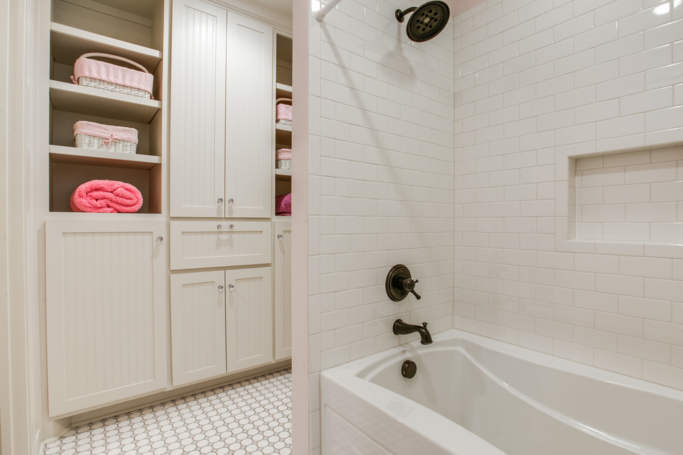 Example of a mid-sized classic kids' white tile and ceramic tile ceramic tile tub/shower combo design in Dallas with an undermount sink, shaker cabinets, white cabinets, granite countertops and gray walls