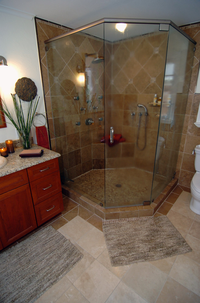 Elegant bathroom photo in Dallas with recessed-panel cabinets and medium tone wood cabinets