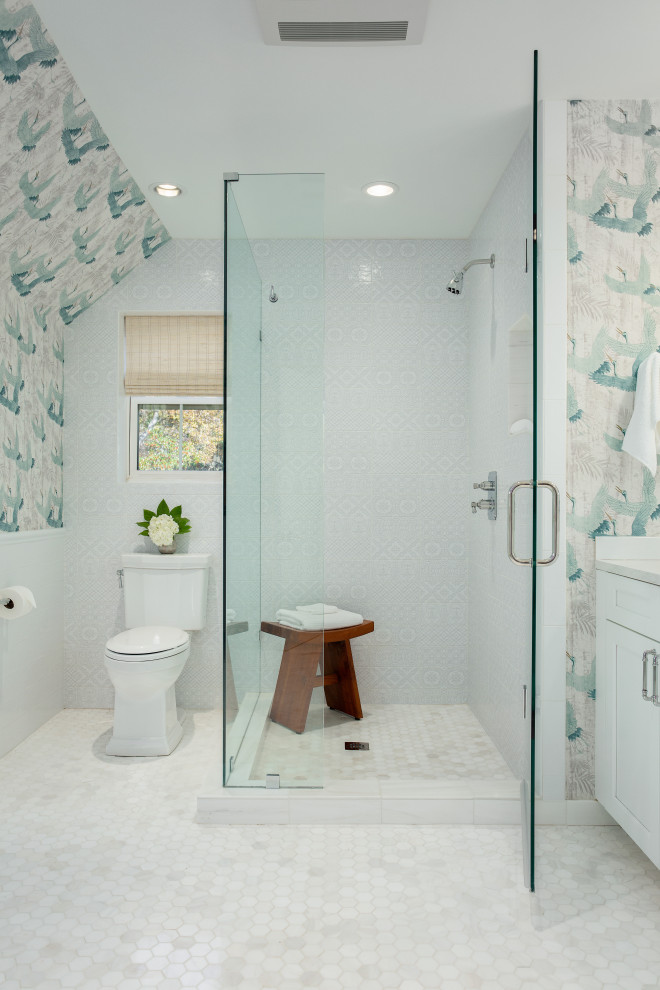 Photo of a large bohemian ensuite bathroom in Dallas with recessed-panel cabinets, white cabinets, a claw-foot bath, a corner shower, a two-piece toilet, ceramic tiles, multi-coloured walls, porcelain flooring, a submerged sink, engineered stone worktops, grey floors, an open shower, white worktops and grey tiles.