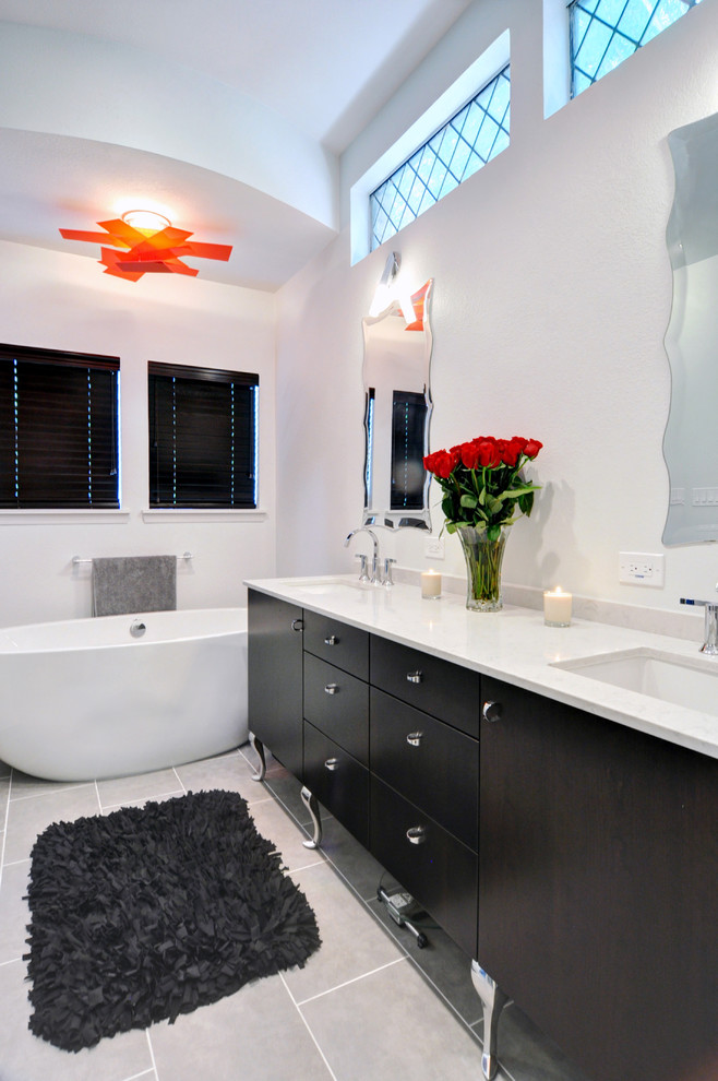Design ideas for a contemporary bathroom in Dallas with a freestanding bath and grey floors.