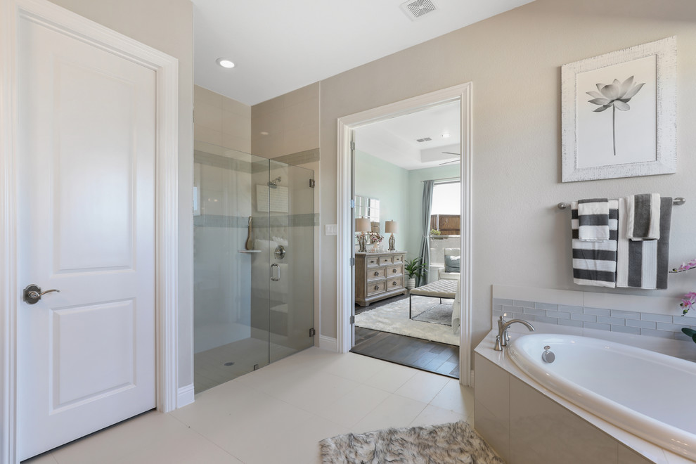 This is an example of a medium sized traditional ensuite bathroom in Dallas with recessed-panel cabinets, beige cabinets, a corner bath, a corner shower, beige tiles, ceramic tiles, beige walls, ceramic flooring, a submerged sink, granite worktops, beige floors, a hinged door and multi-coloured worktops.