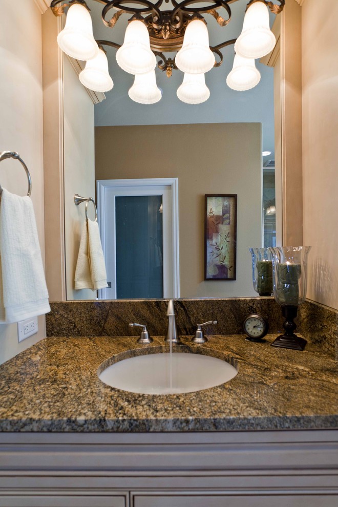 Mid-sized elegant master bathroom photo in Portland with recessed-panel cabinets, beige cabinets, an undermount sink and granite countertops