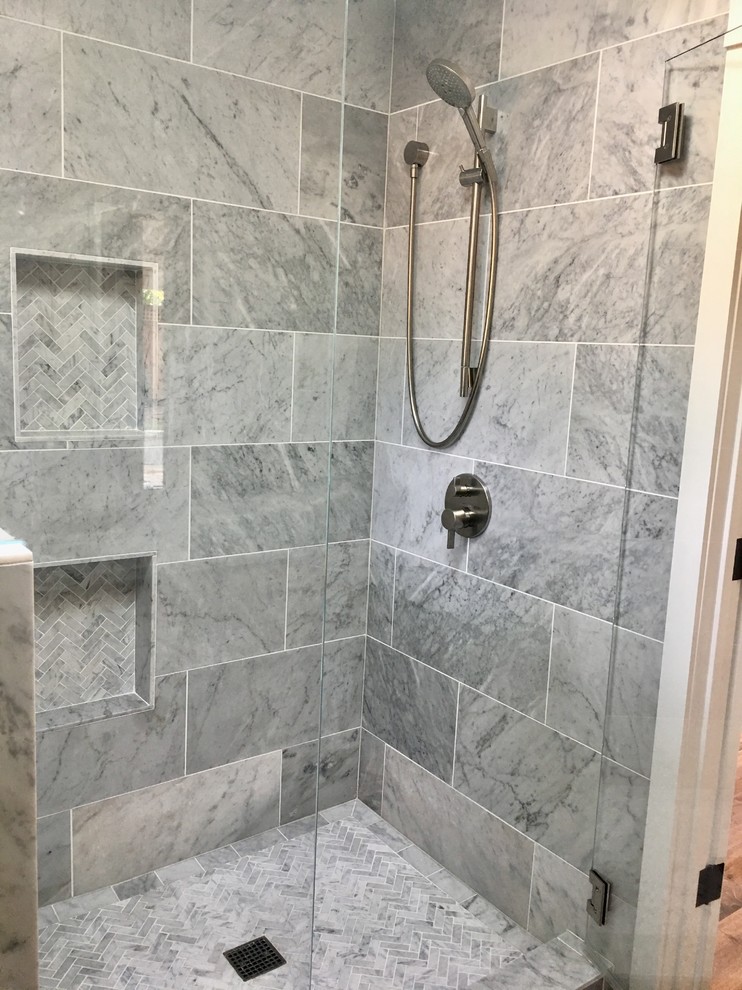 Design ideas for a medium sized contemporary ensuite bathroom in San Francisco with a corner shower, grey tiles, marble tiles, a hinged door, shaker cabinets, medium wood cabinets, a one-piece toilet, grey walls, porcelain flooring, a submerged sink, marble worktops and brown floors.