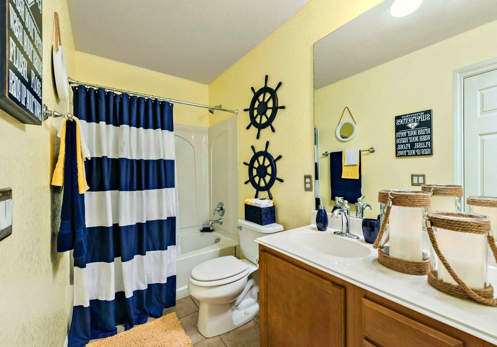 Example of a small beach style bathroom design in Austin with yellow walls