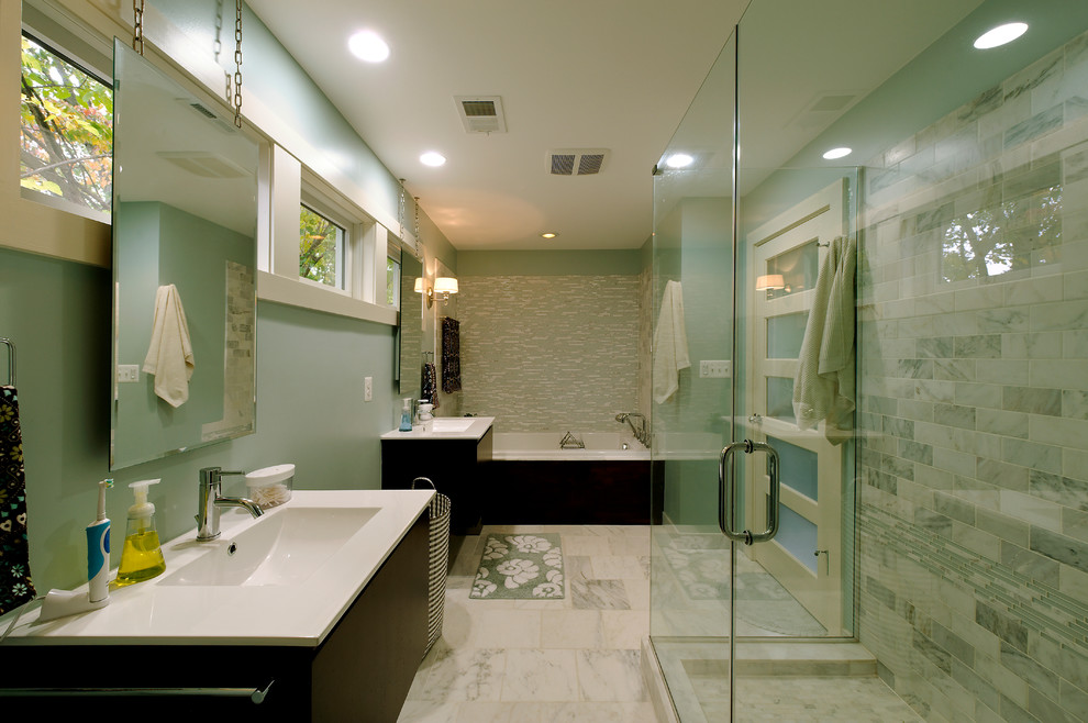 Inspiration for a large beach style ensuite bathroom in DC Metro with flat-panel cabinets, dark wood cabinets, an alcove bath, a corner shower, grey tiles, stone tiles, blue walls, marble flooring, an integrated sink, quartz worktops, white floors and a hinged door.