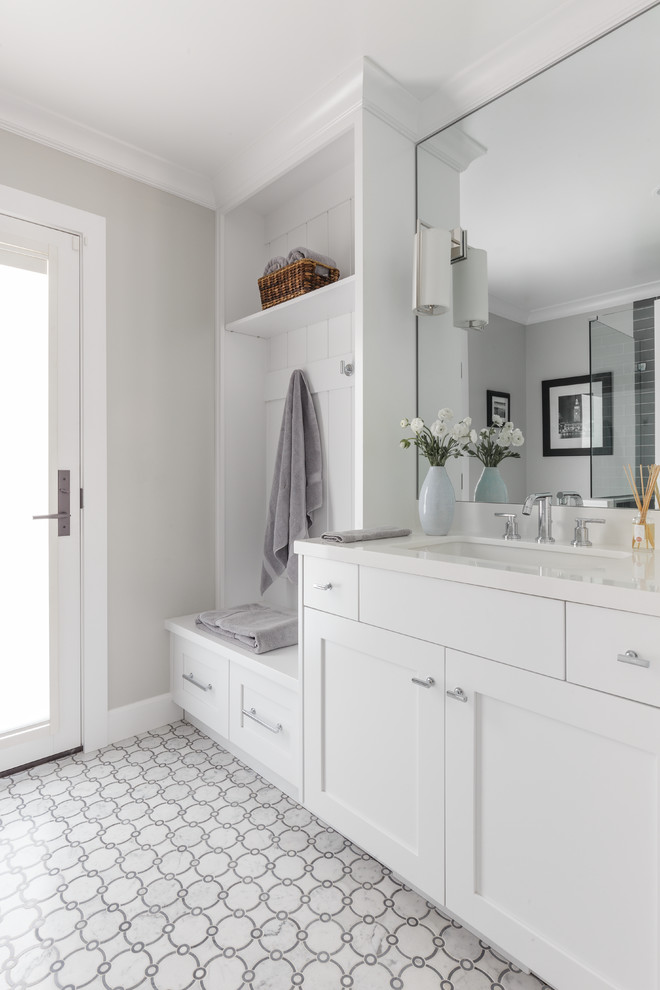 Design ideas for a medium sized traditional ensuite bathroom in San Francisco with shaker cabinets, white cabinets, engineered stone worktops, a one-piece toilet, grey walls, a submerged sink, a hinged door, a corner shower, blue tiles, metro tiles and white floors.