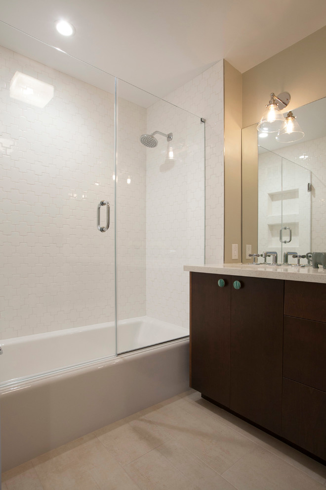 Medium sized classic shower room bathroom in San Francisco with flat-panel cabinets, dark wood cabinets, an alcove bath, a shower/bath combination, a two-piece toilet, white tiles, ceramic tiles, beige walls, a submerged sink and engineered stone worktops.