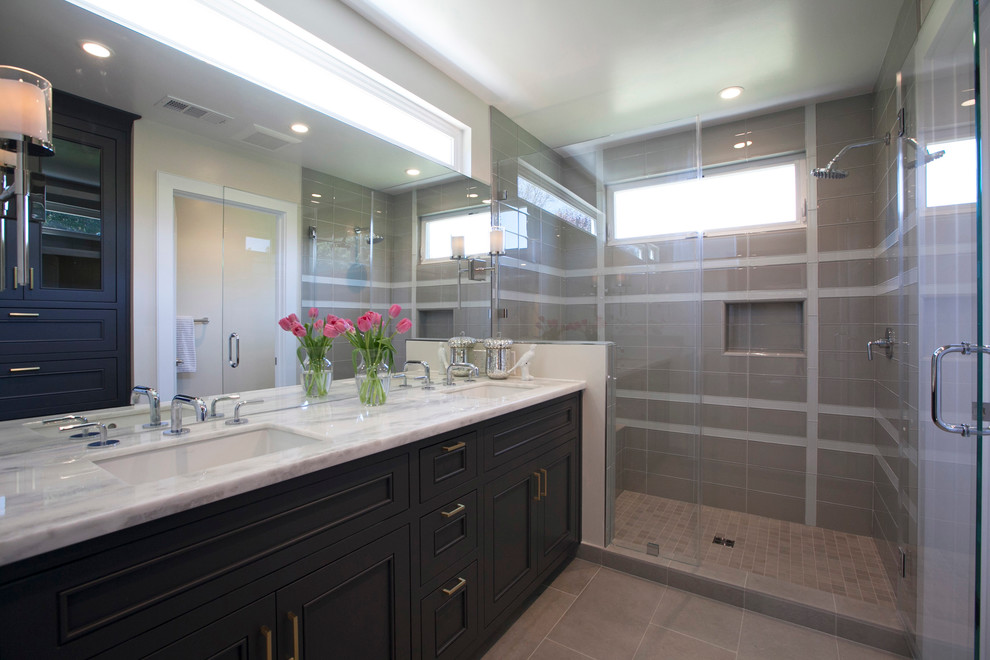 Inspiration for a large transitional master beige tile, gray tile and glass tile porcelain tile alcove shower remodel in San Francisco with recessed-panel cabinets, dark wood cabinets, a two-piece toilet, beige walls, an undermount sink and marble countertops
