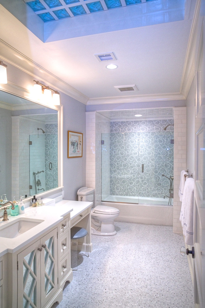 Bathroom - large coastal white tile and subway tile mosaic tile floor and gray floor bathroom idea in New York with shaker cabinets, beige cabinets, a two-piece toilet, gray walls, an undermount sink and a hinged shower door